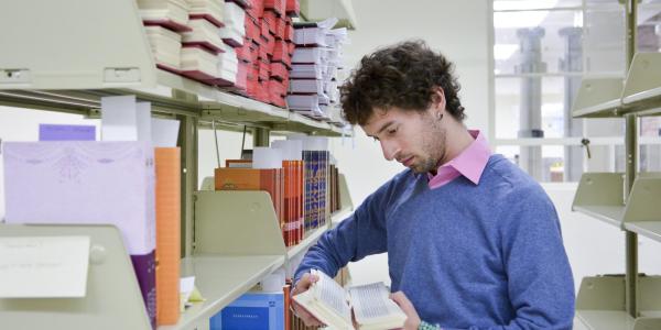 Graduate student in the library archives