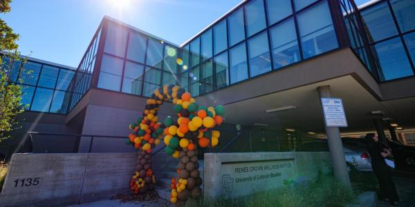 Crown Institute building exterior with balloon arch