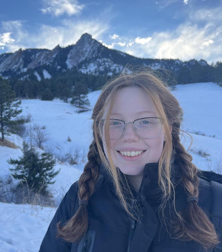 Sarah Bruce in front of the Boulder Flatirons