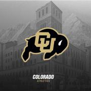 A Colorado Athletics logo against a black and white image of a building and the Flatirons.